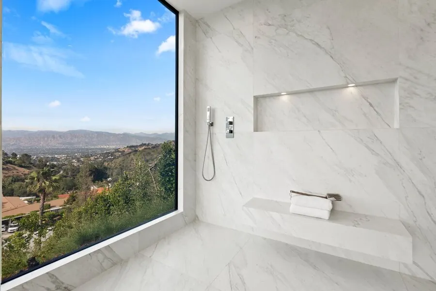 Skyline marble shower framing a valley view